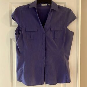 Flattering two pocket blue blouse